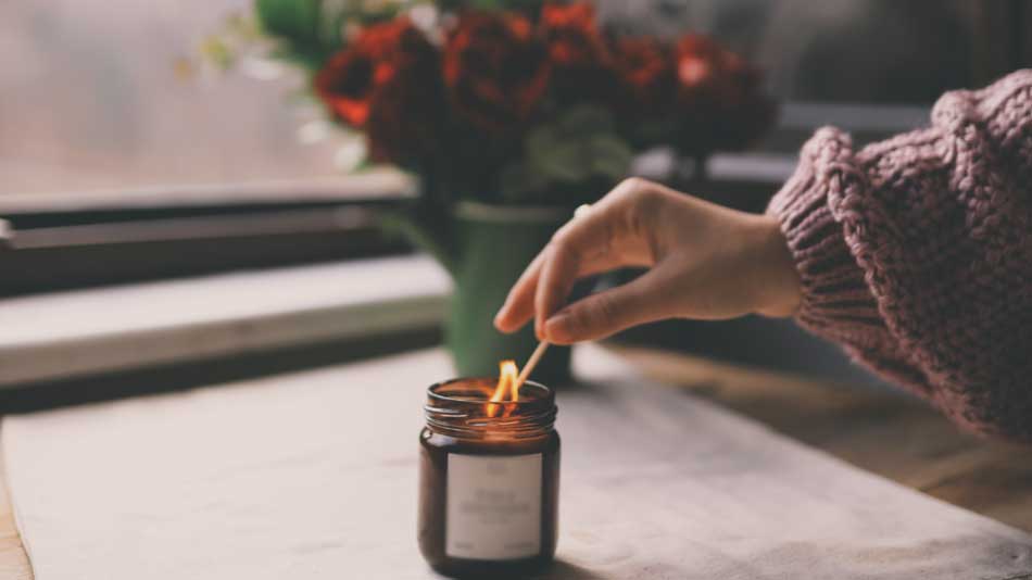 Lighting a candle as way of practicing self-care